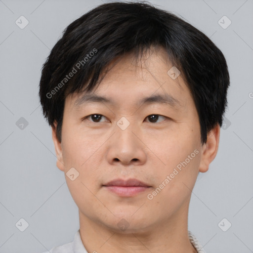 Neutral asian young-adult male with short  brown hair and brown eyes