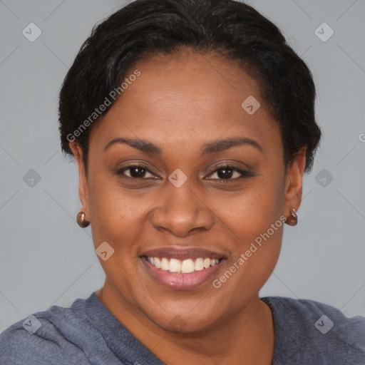 Joyful black young-adult female with short  brown hair and brown eyes