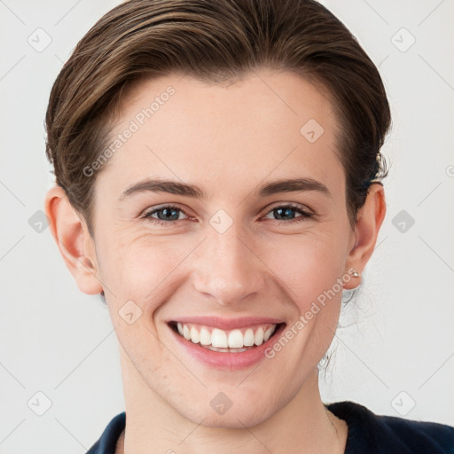 Joyful white young-adult female with short  brown hair and grey eyes