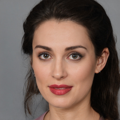 Joyful white young-adult female with medium  brown hair and brown eyes