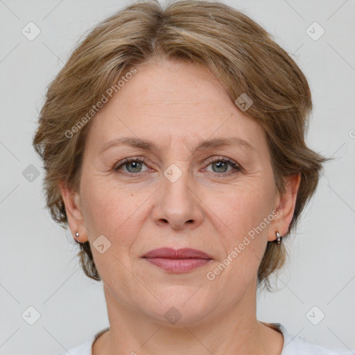 Joyful white adult female with medium  brown hair and grey eyes