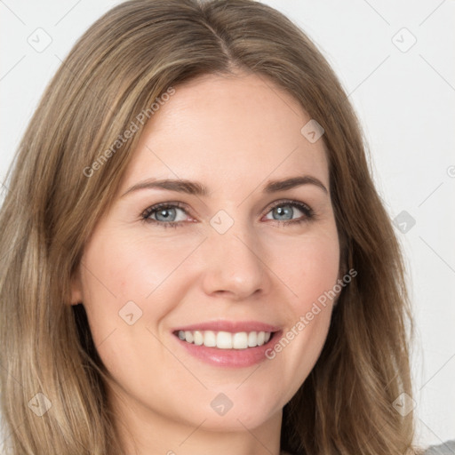 Joyful white young-adult female with long  brown hair and green eyes