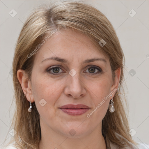 Joyful white adult female with long  brown hair and grey eyes