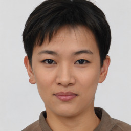 Joyful asian young-adult female with short  brown hair and brown eyes