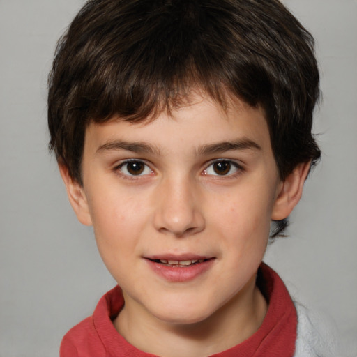 Joyful white child male with short  brown hair and brown eyes