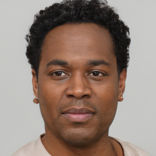 Neutral black young-adult male with short  black hair and brown eyes