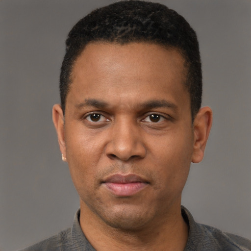 Neutral latino adult male with short  black hair and brown eyes