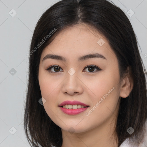 Joyful asian young-adult female with long  brown hair and brown eyes