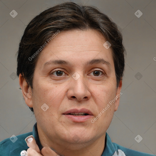 Joyful white adult female with short  brown hair and grey eyes