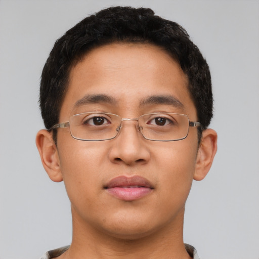 Joyful latino young-adult male with short  brown hair and brown eyes