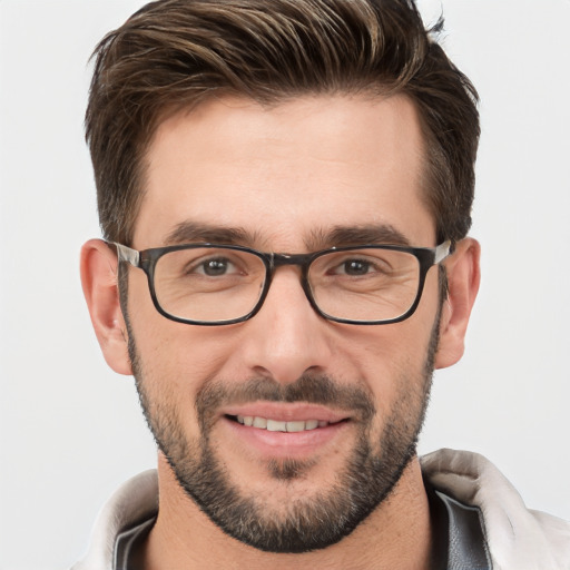 Joyful white young-adult male with short  brown hair and brown eyes