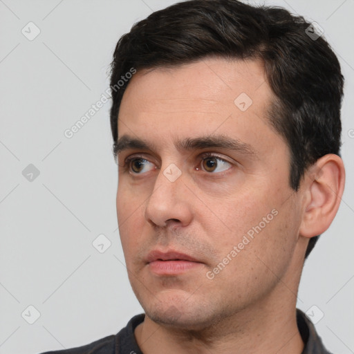 Neutral white adult male with short  black hair and brown eyes