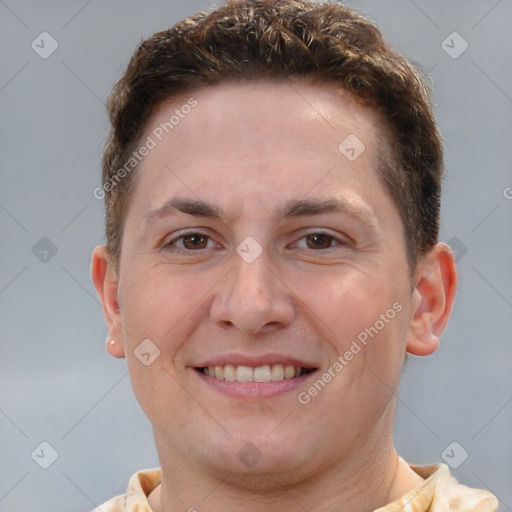 Joyful white young-adult male with short  brown hair and grey eyes