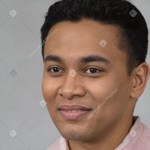 Joyful latino young-adult male with short  black hair and brown eyes