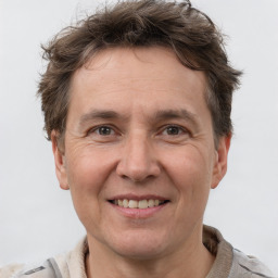 Joyful white adult male with short  brown hair and grey eyes