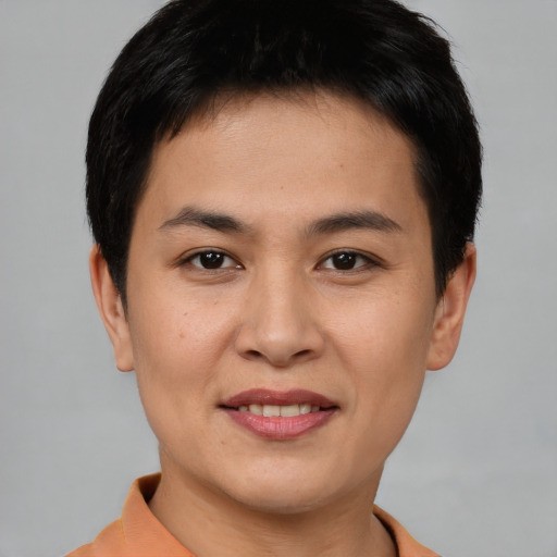 Joyful asian young-adult female with short  brown hair and brown eyes
