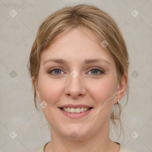 Joyful white young-adult female with medium  brown hair and blue eyes