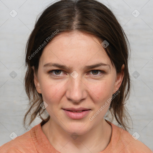 Joyful white young-adult female with medium  brown hair and blue eyes