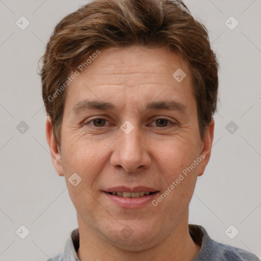 Joyful white adult male with short  brown hair and grey eyes