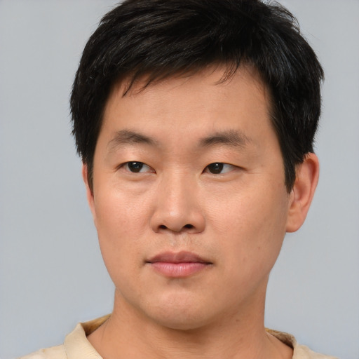 Neutral asian young-adult male with short  brown hair and brown eyes
