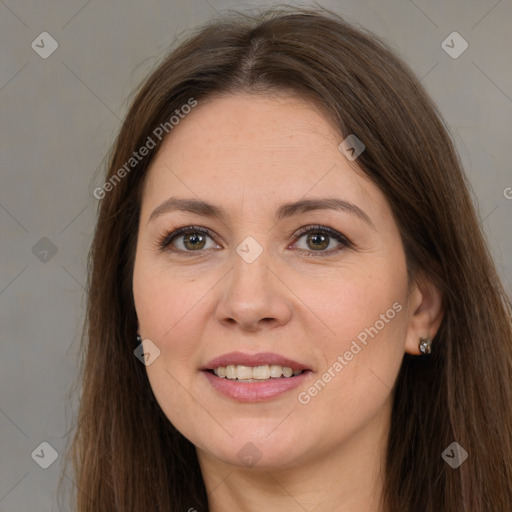 Joyful white adult female with long  brown hair and brown eyes