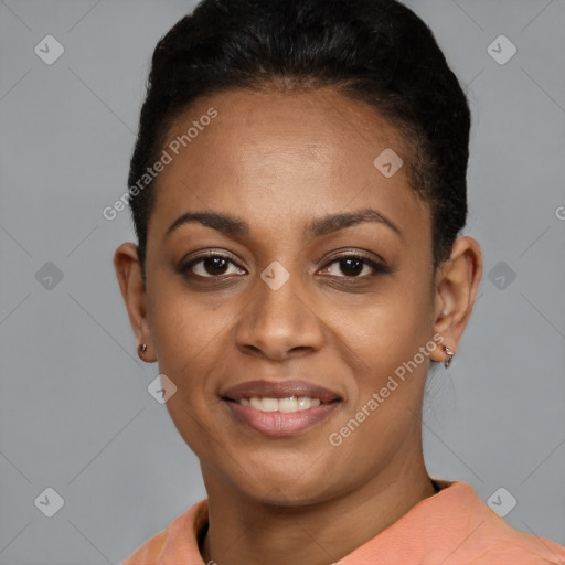 Joyful black young-adult female with short  black hair and brown eyes