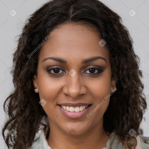 Joyful black young-adult female with long  brown hair and brown eyes