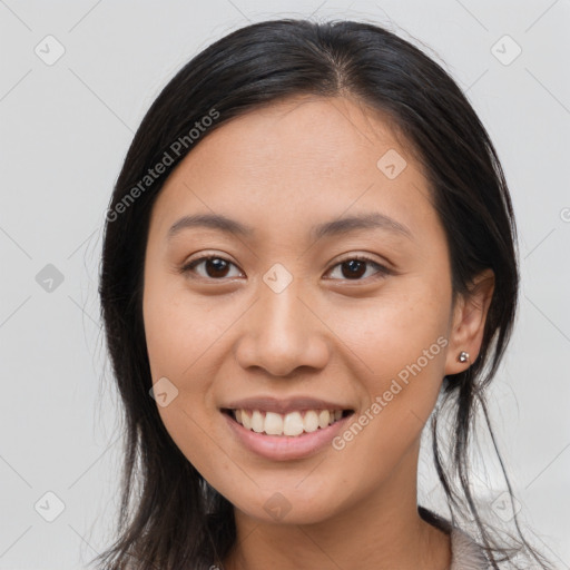 Joyful white young-adult female with long  brown hair and brown eyes