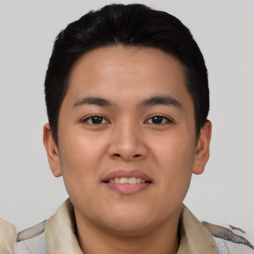 Joyful asian young-adult male with short  black hair and brown eyes