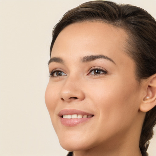 Joyful white young-adult female with medium  brown hair and brown eyes