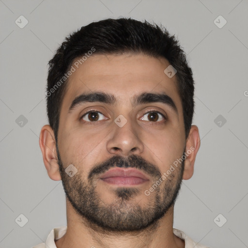 Joyful latino young-adult male with short  brown hair and brown eyes