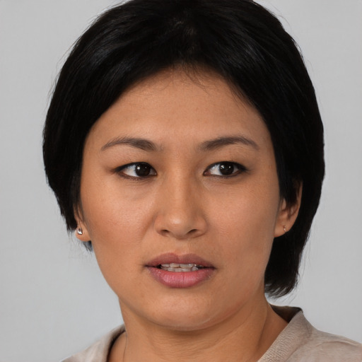 Neutral asian young-adult female with medium  black hair and brown eyes
