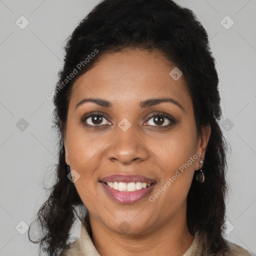 Joyful black young-adult female with long  black hair and brown eyes