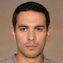 Neutral white young-adult male with short  black hair and brown eyes