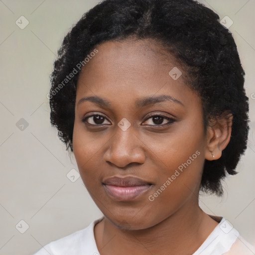 Joyful black young-adult female with medium  black hair and brown eyes