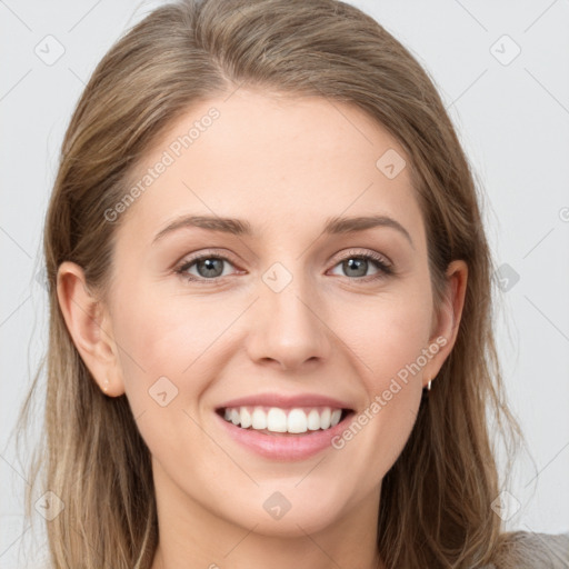 Joyful white young-adult female with long  brown hair and grey eyes