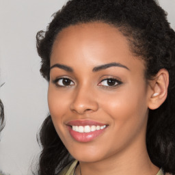 Joyful latino young-adult female with long  black hair and brown eyes