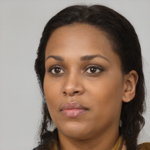 Neutral black young-adult female with medium  brown hair and brown eyes