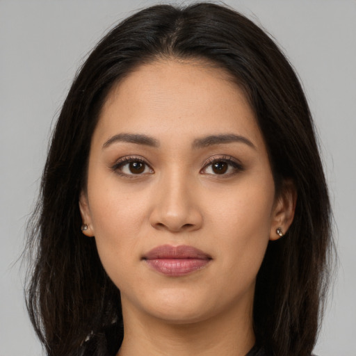 Joyful white young-adult female with long  brown hair and brown eyes