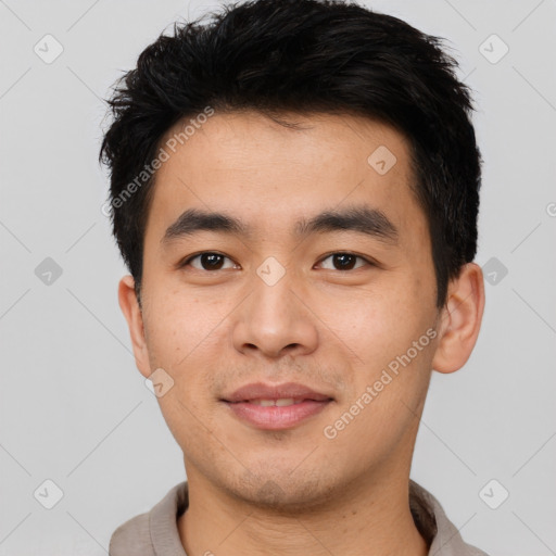 Joyful asian young-adult male with short  black hair and brown eyes