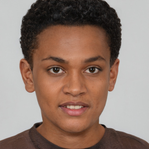 Joyful black young-adult male with short  brown hair and brown eyes