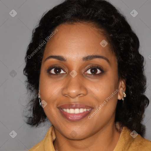 Joyful black young-adult female with long  black hair and brown eyes