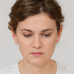 Neutral white young-adult female with short  brown hair and brown eyes