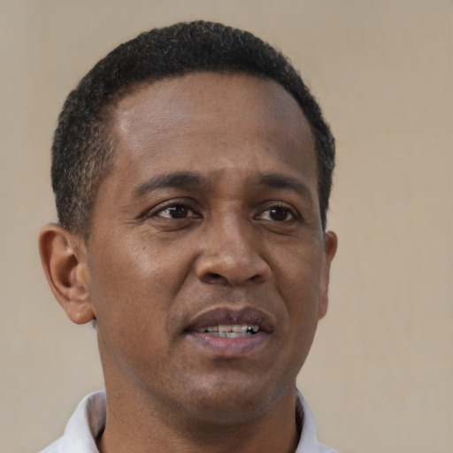 Neutral black young-adult male with short  brown hair and brown eyes