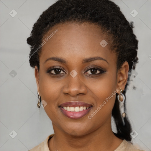 Joyful black young-adult female with long  brown hair and brown eyes