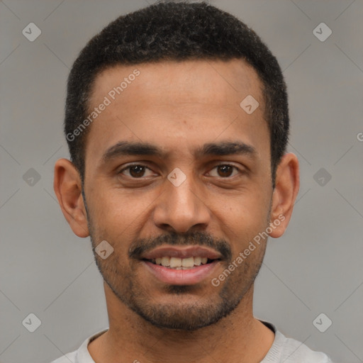 Joyful latino young-adult male with short  black hair and brown eyes