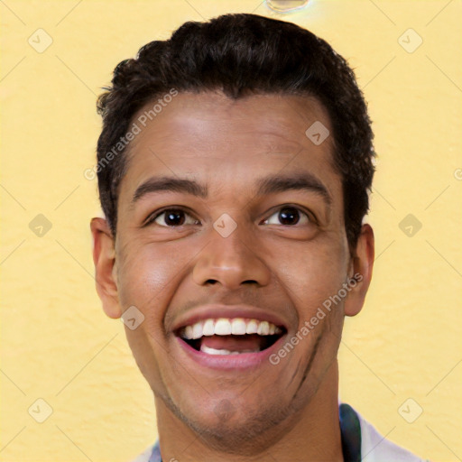 Joyful white young-adult male with short  black hair and brown eyes