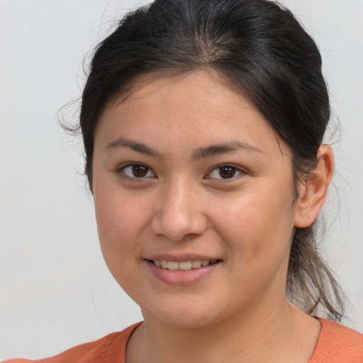 Joyful white young-adult female with medium  brown hair and brown eyes