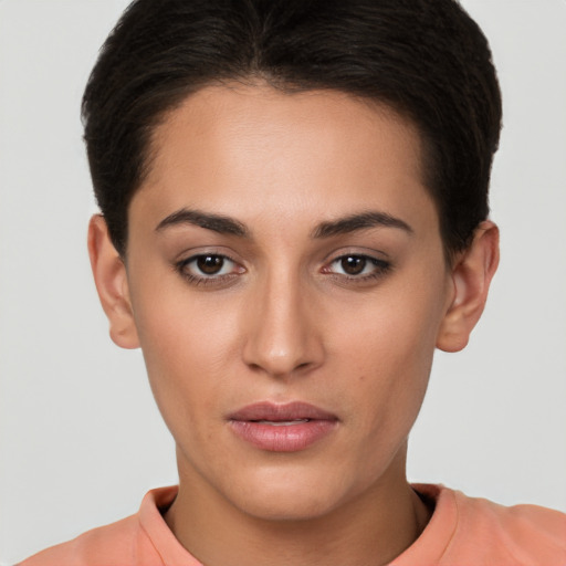 Joyful white young-adult female with short  brown hair and brown eyes