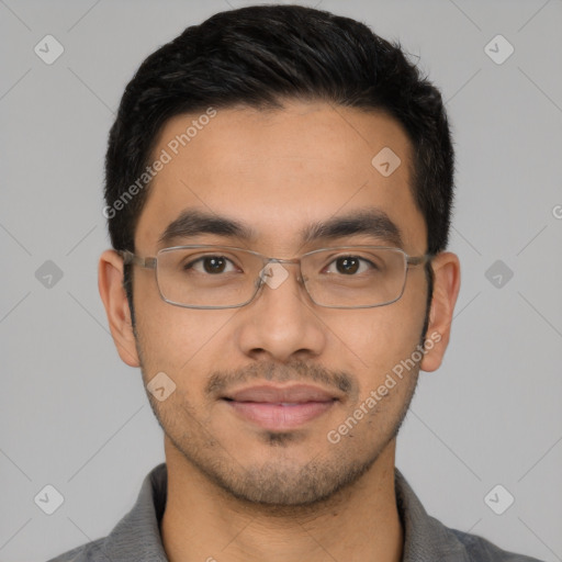 Joyful latino young-adult male with short  black hair and brown eyes